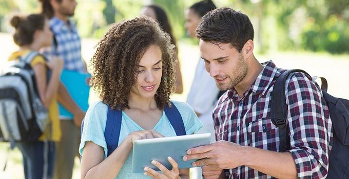 Students looking at an tablet computer