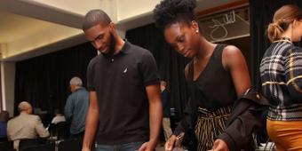 Students browsing materials at a campus event